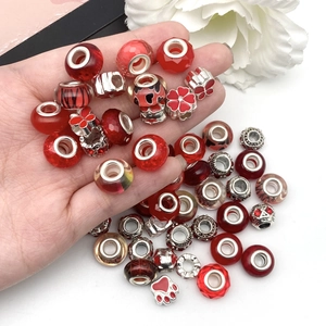 Red and silver assorted DIY charm beads for bracelets with floral and paw print designs
