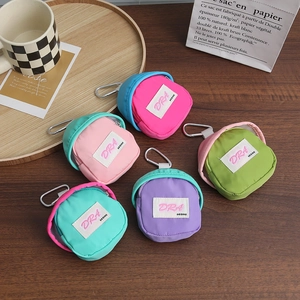 Mini backpack coin purses in vibrant candy colors with carabiners for outdoor storage