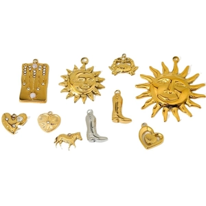 Assorted stainless steel charms including sun, boot, and heart in gold and silver finish