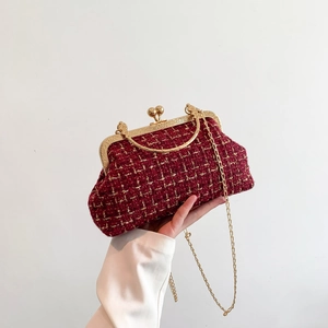 Retro red woven shell bag with gold handle, metal frame, and detachable chain strap