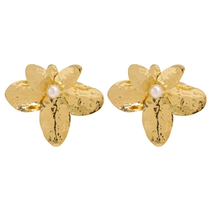 Close-up of golden flower earrings with hammered texture and white pearls in center