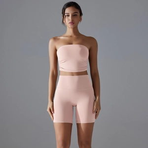 Close-up of pink high-waist scrunch shorts and tube top set for fitness and yoga