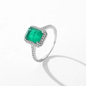 Elegant S925 sterling silver ring featuring emerald-cut green gemstone with pavé diamonds