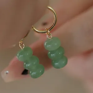 Handmade gold hoop earrings with three stacked green aventurine beads for women