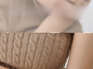 Detail of cable knit pattern on camel brown chunky sweater showing rich textile texture