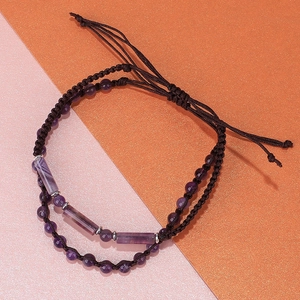 Handmade amethyst stone beaded bracelet with purple cylinder beads on braided rope