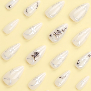 Long almond press-on nails with silver heart kanji and abstract metallic designs