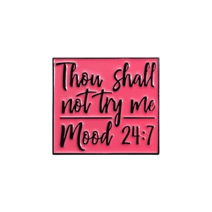Pink enamel pin featuring Thou shall not try me Mood 24:7 text with black metal frame