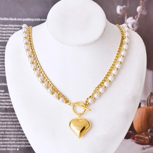 Double-layer gold Cuban and pearl chain necklace with a polished heart pendant and OT clasp