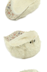 Detailed view of cream lace floral beret with fresh floral lining and metal buckle