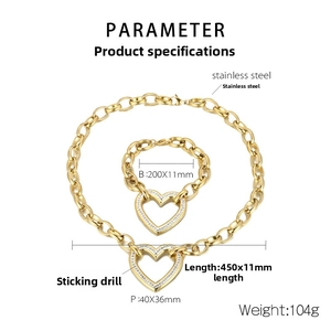 Detailed view of gold stainless steel chunky chain set with crystal heart pendants