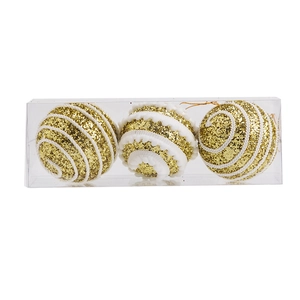 Detailed view of three 8cm gold and white glitter Christmas balls in clear plastic packaging