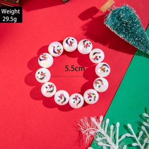 Christmas snowman resin bead elastic bracelet with iridescent pearl finish on festive background