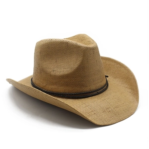 Detail view of woven straw cowboy hat showing texture and black decorative cord