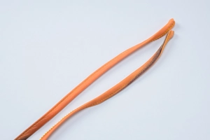 Macro view of orange thin straps with yellow double-needle stitching on summer floral dress