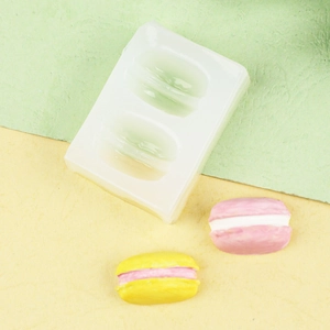 Moule en silicone macaron pour pâtisserie et loisirs créatifs avec deux cavités sur fond clair
