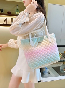 Lifestyle view of large gradient quilted tote bag showing its size and fashion fit on shoulder