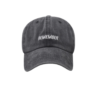 Washed dark gray cotton baseball cap with white REMEMBER embroidery in retro style