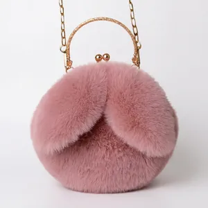 Cute pink plush rabbit ear handbag with gold metal handle and chain strap for women
