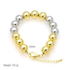 Detail of 12mm gold and silver beaded bracelet with lobster clasp, weighing 19.1g
