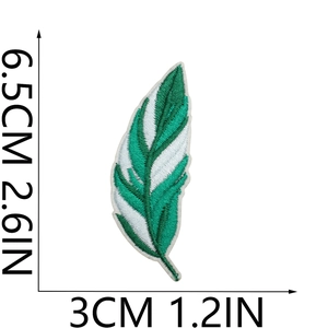 Close-up of green and white feather embroidered patch with detailed size measurements
