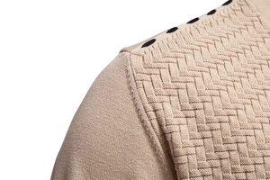 Detail view of khaki knit cardigan showing wavy texture and shoulder dot patterns