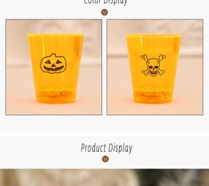 Close-up of orange Halloween LED cups with spooky pumpkin and skull face patterns