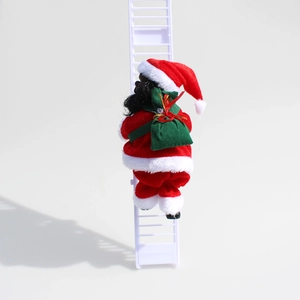 Detail of climbing Santa Claus doll in velvet suit with green gift bag on white ladder