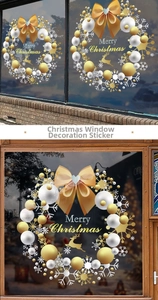Close-up of golden Christmas wreath window stickers with reindeer and snowflake details