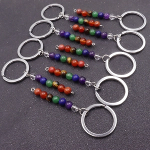 Detailed close-up of chakra-themed natural crystal beaded metal keychains in 6-piece set