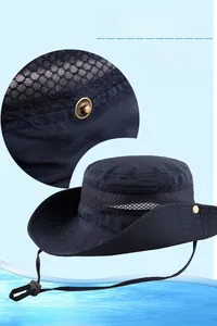 Detail of blue sun hat showing breathable mesh panels and adjustable metal side buckles