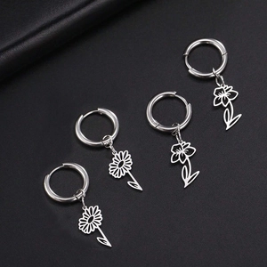 Silver stainless steel hoop earrings with floral charms featuring sunflower and lily motifs