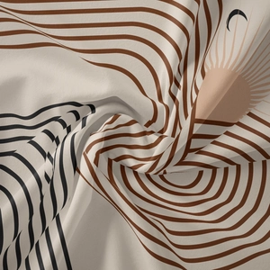 Detailed macro shot of bohemian wall tapestry showing soft fabric texture and sun pattern