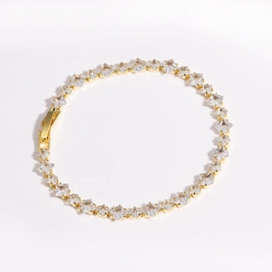 Detail showing high-quality gold tennis bracelet with princess cut cubic zirconia stones