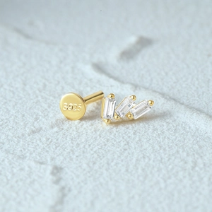 Macro detail of S925 silver flat back stud showing the quality hallmark and inlaid gems