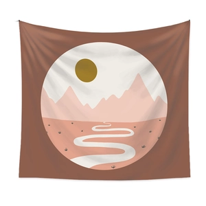 Detail of Boho landscape tapestry showing pink mountains and sun on earthy brown fabric