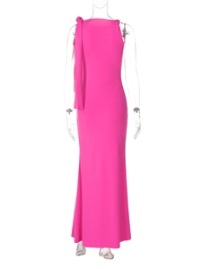 Detail of fuchsia long dress featuring a sleeveless round neck and shoulder ribbon