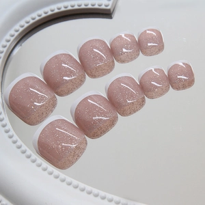 Faux ongles d'orteils blancs à bout français pailleté rose poudré fini brillant