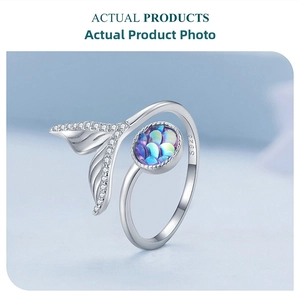 Detail view of S925 sterling silver mermaid tail ring with iridescent scales and engraving