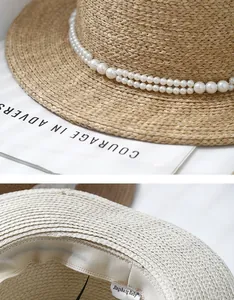 Detail of straw sun hat featuring double-row pearl beads and inner branded sweatband