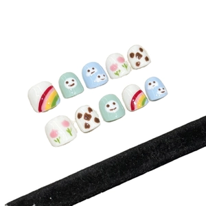 Handmade press-on nails for kids with cute rainbow and cloud hand-painted designs