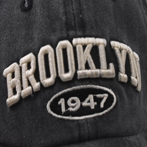 Detailed macro view of Brooklyn 1947 3D embroidery on washed cotton baseball cap