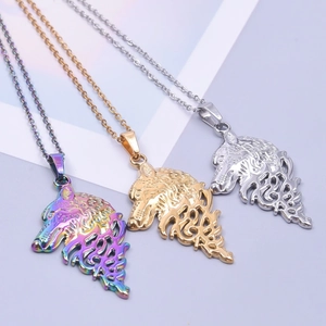 Macro detail of hollow wolf head pendants in iridescent, gold, and silver finishes