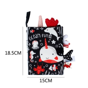Detailed view of ocean-themed baby soft book with narwhal design and size dimensions