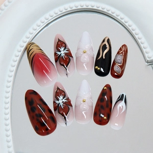 Red brown leopard print press-on nails with 3D floral accents and cat-eye finish