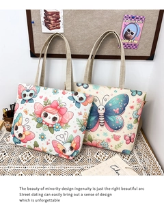 Detail of canvas tote bag with butterfly print and natural linen texture on lace background