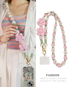 Detail of hand-woven floral phone lanyard with smile embroidery and metal carabiner hook
