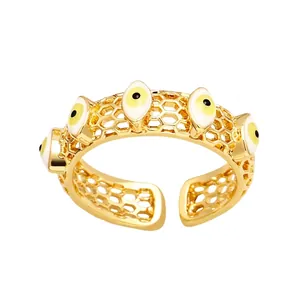 Bague ouverte dorée mauvais oeil pour femme avec cinq motifs d'yeux en émail incrustés