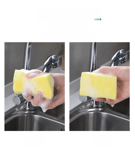 Dual-sided dish sponge showing high resilience after squeezing with soap foam