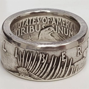 Vintage silver dollar coin ring featuring Liberty relief and intricate eagle engraving